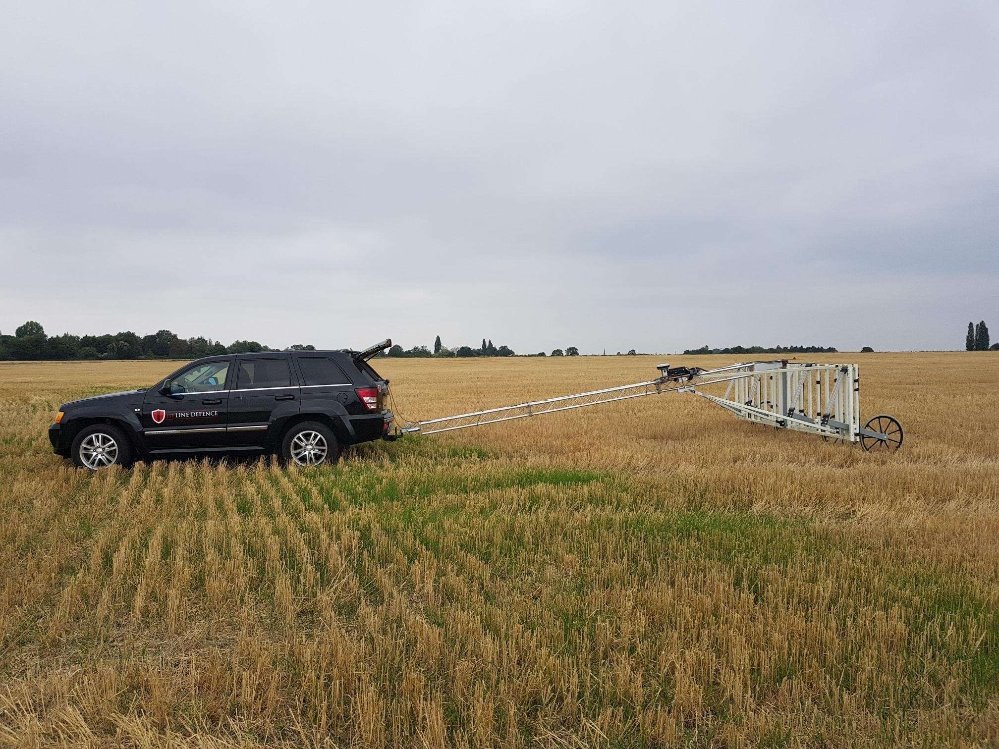 1st Line Defence vehicle using a towed-array Non-intrusive UXO Survey system.