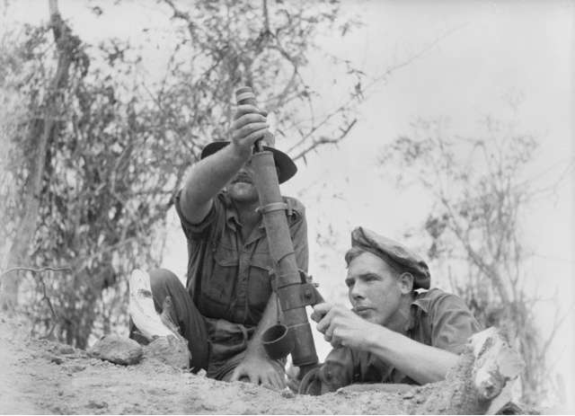 Australian infantrymen using a 2-inch (51 mm) mortar at New Guinea in 1945.