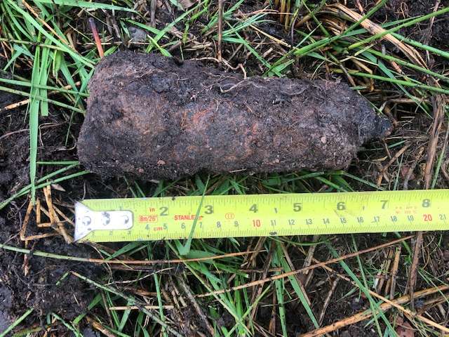 WWII-era 2-inch mortar round in poor condition which was discovered on a Scottish wind farm project by 1st Line Defence.