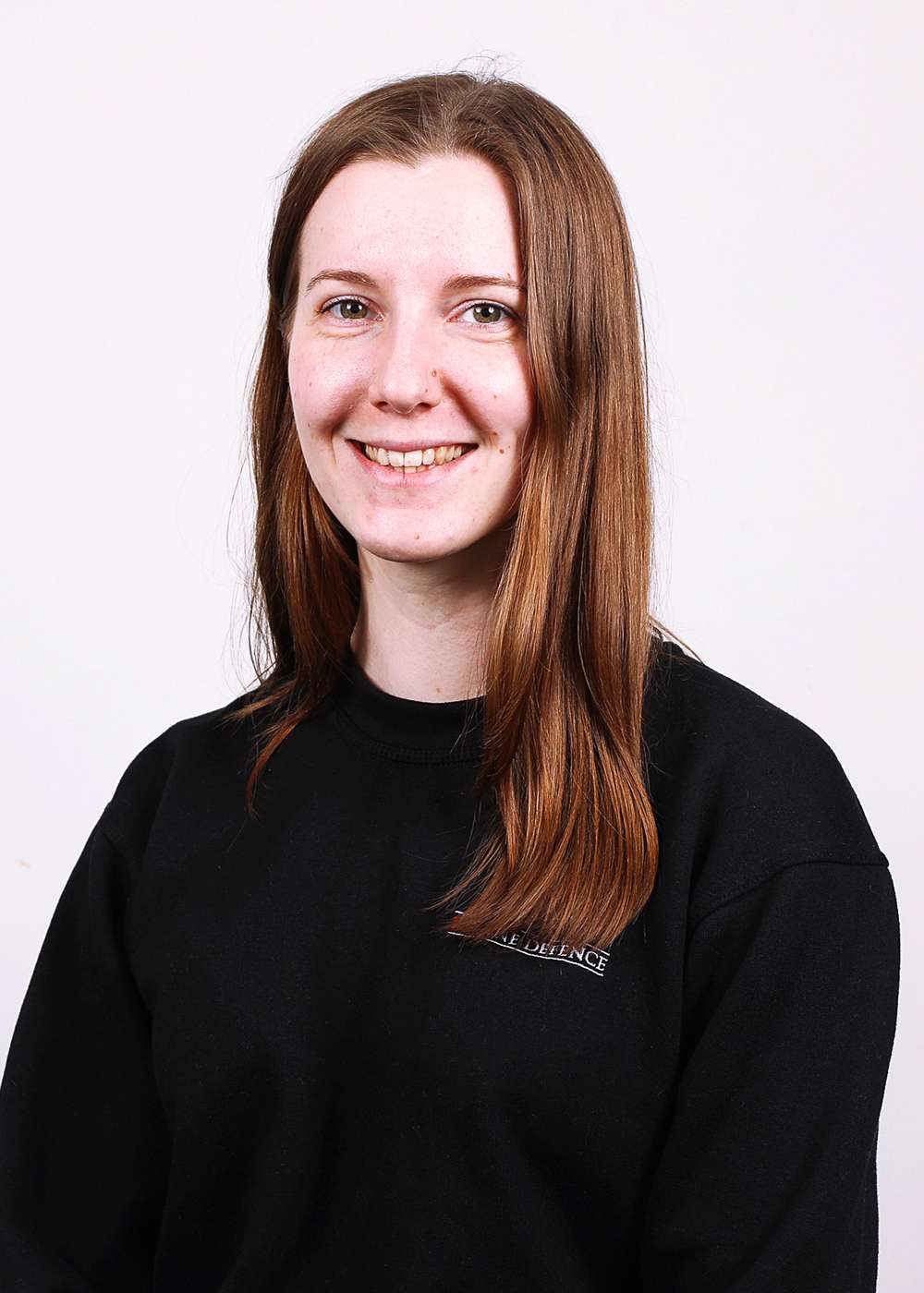 Head shot of Maddie, Operations Manager at 1st Line Defence