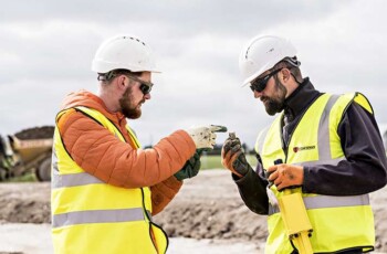 1st Line Defence operatives inspecting a suspicious item of potential UXO on a construction site