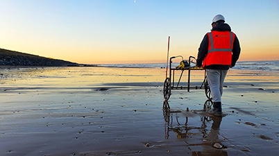 1st Line Defence conducting a Non-intrusive Survey for a marine project in the UK with the sunset in the background