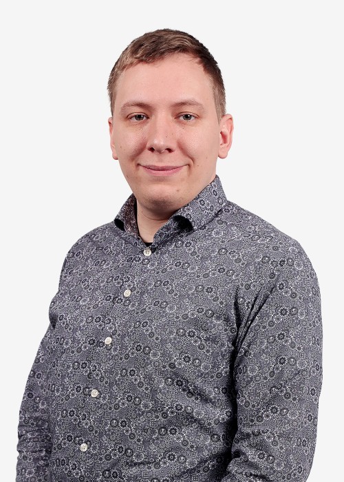Headshot of Alex, Research & QA Manager at 1st Line Defence
